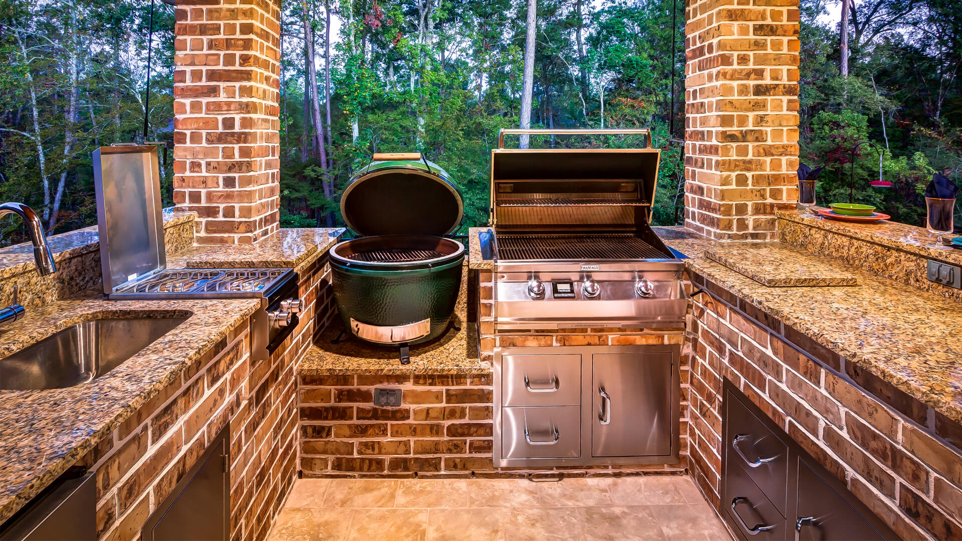 Covered Patio with Summer Kitchen by Creekstone Outdoor Living