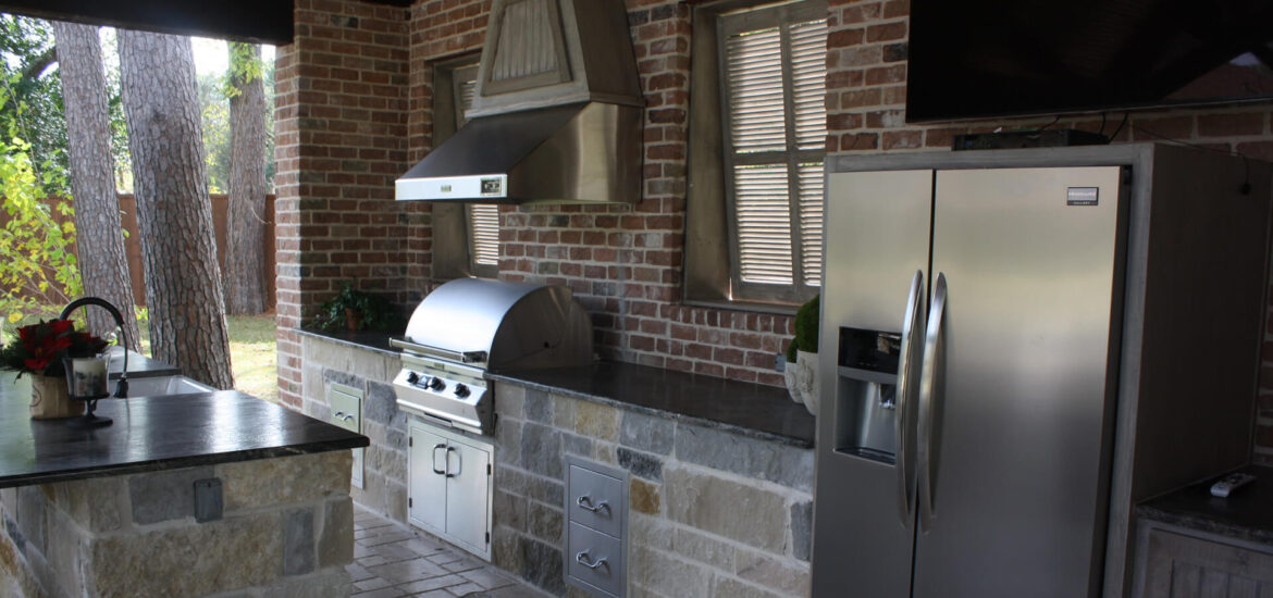 A Full Outdoor Kitchen and full size Refrigerator in Hoston