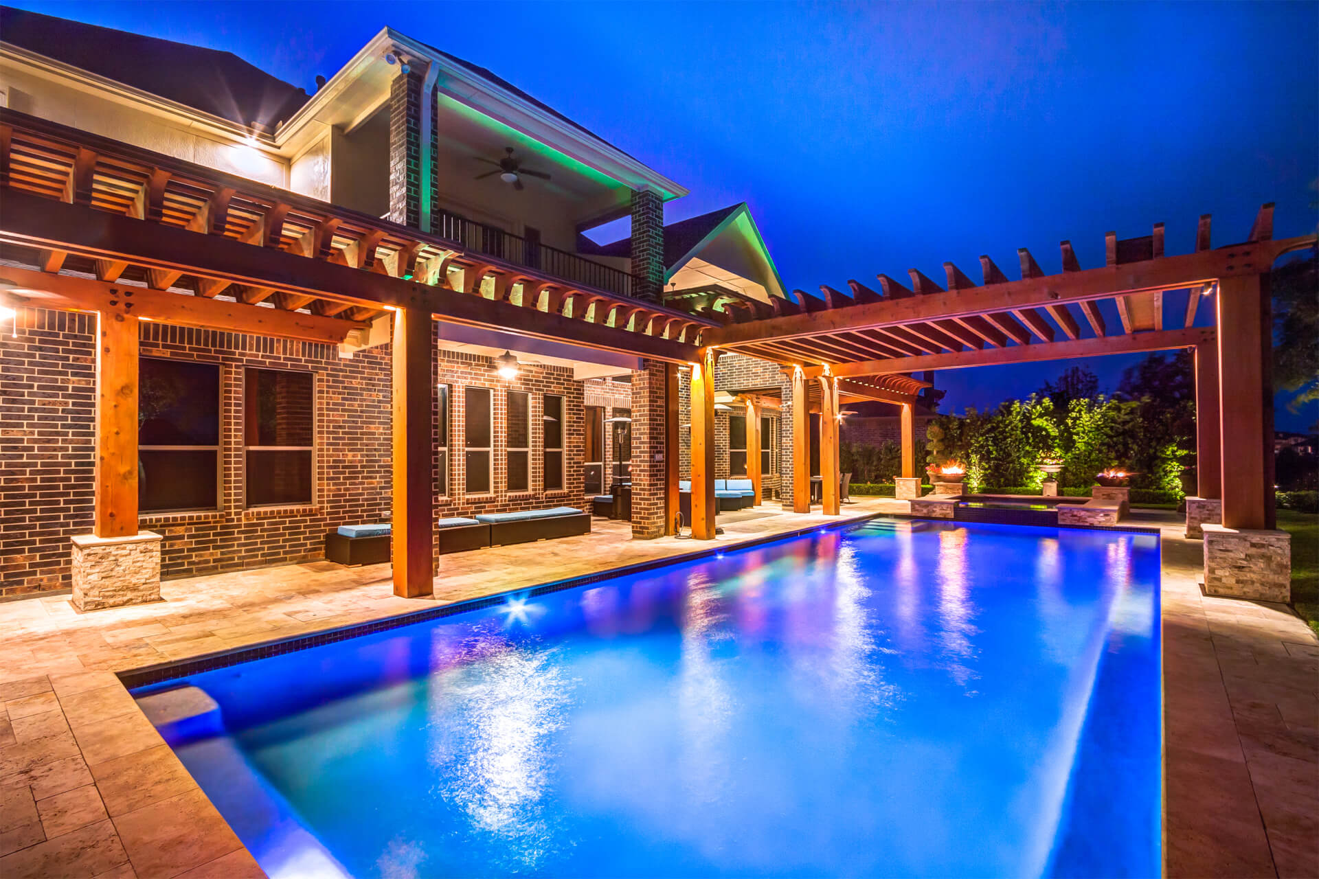 Custom Cedar Pergola over Pool with Living Space and Outdoor Kitchen in Houston, Texas